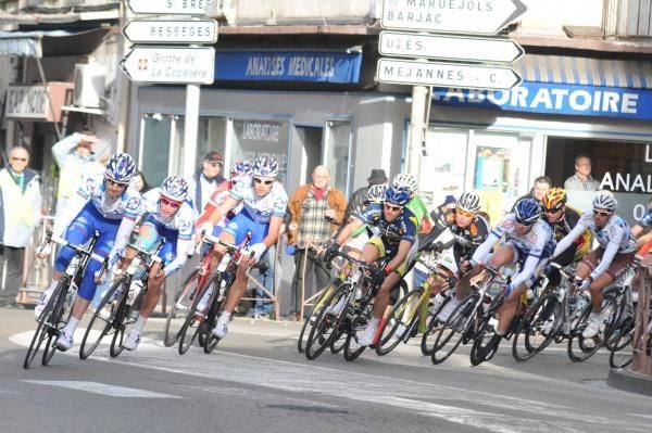 The early season French peloton takes a corner at speed