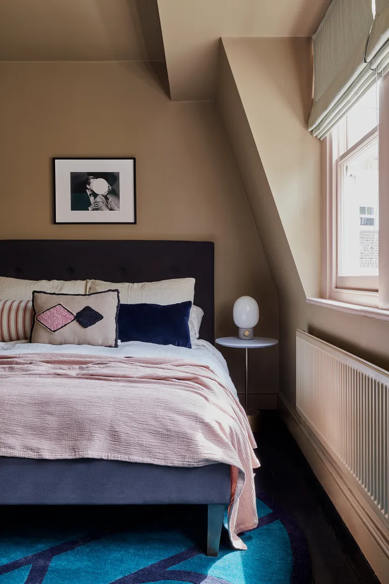 Little Boy Blue is a light blue painted on the walls in this bedroom