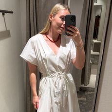 Woman wears white dress