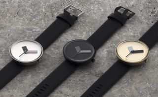 Watches showing the availability of three colours: carbon (black), steel (silver) and gold, with different coloured hands on each