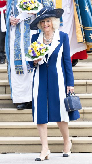 Queen Camilla in a stripy blue coat and dress