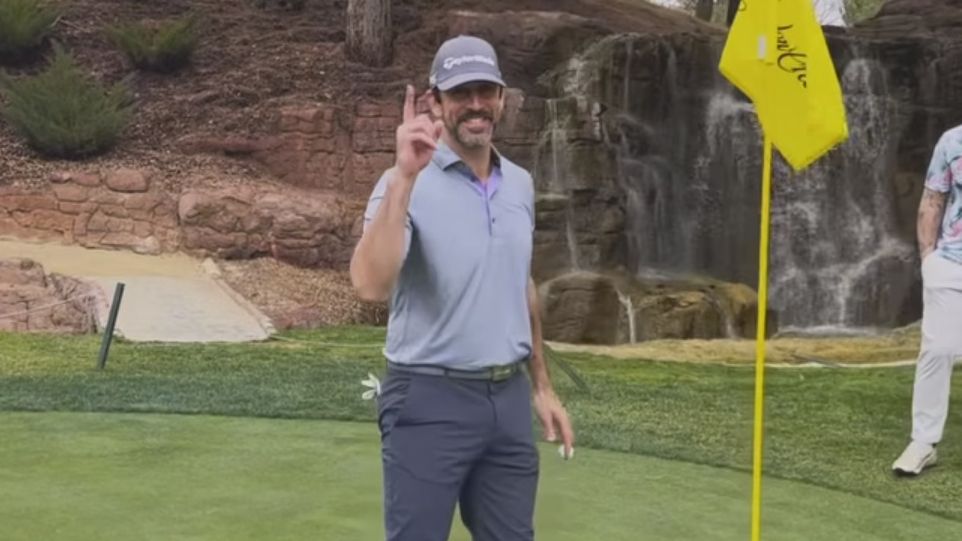 Aaron Rodgers celebrates after hitting a hole-in-one at Shadow Creek