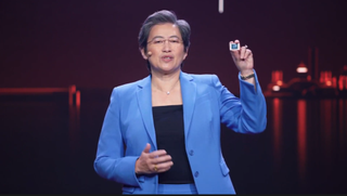 AMD CEO holding laptop processor