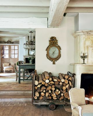 warm white hallway with fireplace and log pile