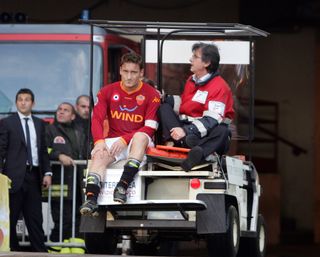 Roma's Francesco Totti goes off injured in a game against Livorno in April 2008.