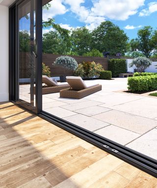 Open glass sliding patio doors on a modern home extension