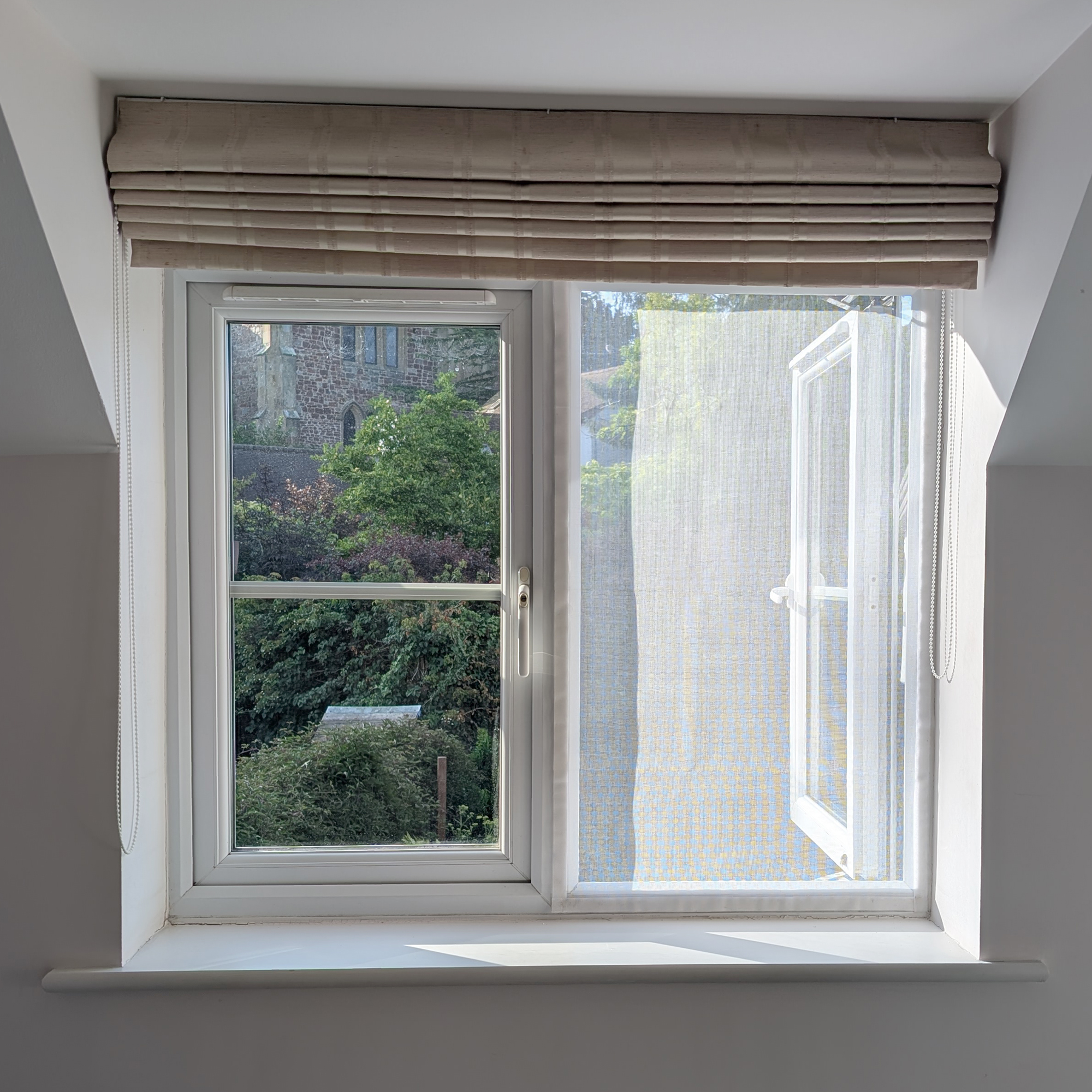 A DIY mosquito screen made with Velcro tape and fly mesh cut to size