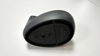 Logitech Lift mouse upside down, showing connectivity button