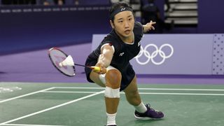 South Korea's An Se-young, dressed all in black, plays a shot in the women's singles badminton at the 2024 Paris Olympic Games.