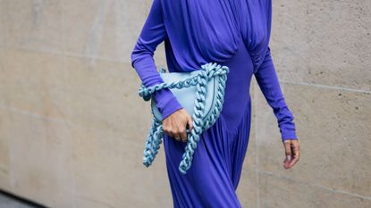 a woman wearing a blue dress and carrying a blue bag - blueberry milk nails
