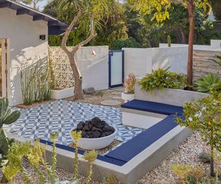 A fire pit in a garden in Highland Park, LA, designed by Russell Wightman