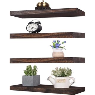 Rustic wood floating shelves made from Paulowina wood with assorted trinkets