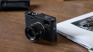 Leica M11-P camera on a wooden surface