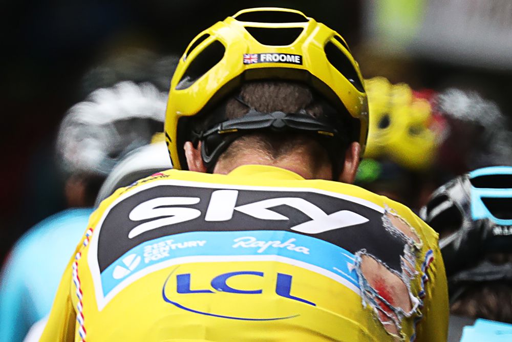 Yellow jersey Chris Froome (Team Sky) crashed on the slippery roads, stage 19 at the Tour de France