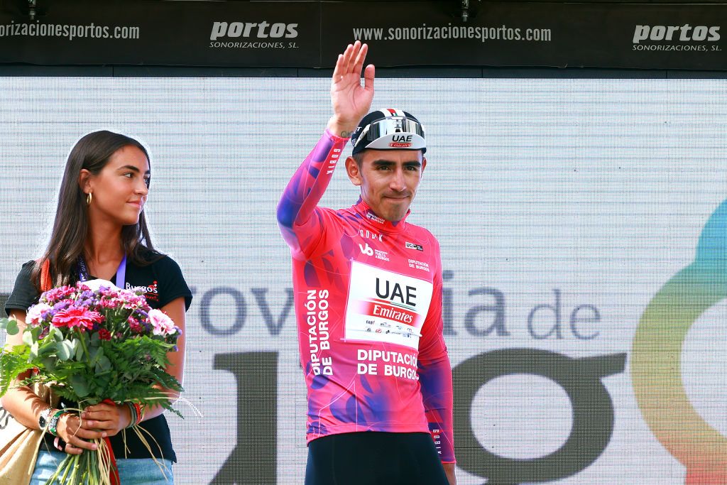 BURGOS SPAIN AUGUST 15 Juan Sebastian Molano Benavides of Colombia and UAE Team Emirates celebrates at podium as during the 45th Vuelta a Burgos 2023 Stage 1 a 161km stage from Villalba de Duero to Burgos on August 15 2023 in Burgos Spain Photo by Gonzalo Arroyo MorenoGetty Images