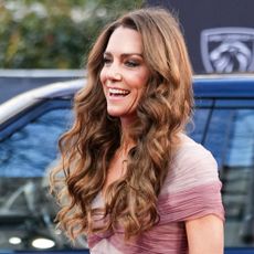 Princess Kate wearing a pink gown smiling