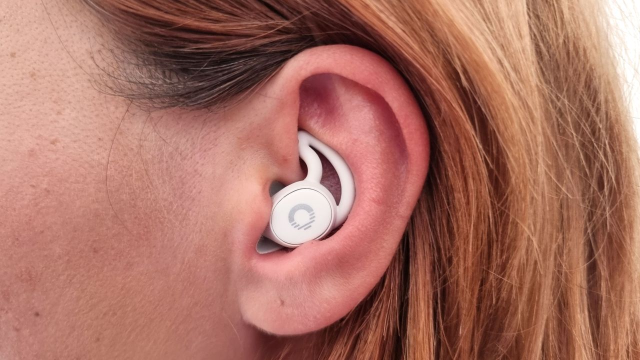 A close-up picture of our reviewer testing the Ozlo Sleepbuds