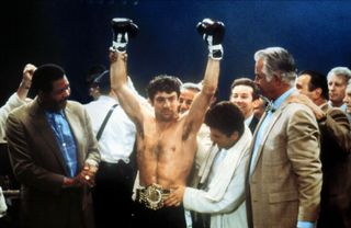 robert de niro celebrating after winning a boxing match in the movie raging bull