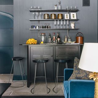 living room with grey wall and bar counter with stools