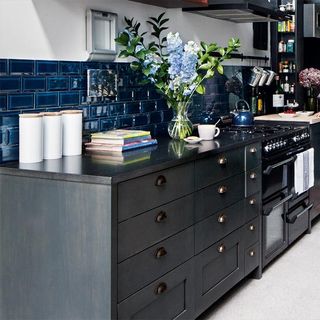kitchen with blue tile and grey counter