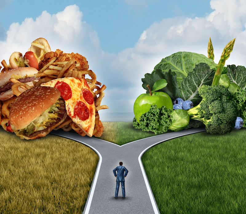 An artist&#039;s image shows a person trying to decide whether to eat healthy food or tastier junk food.