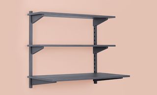Grey wall mounted desk with two shelves above