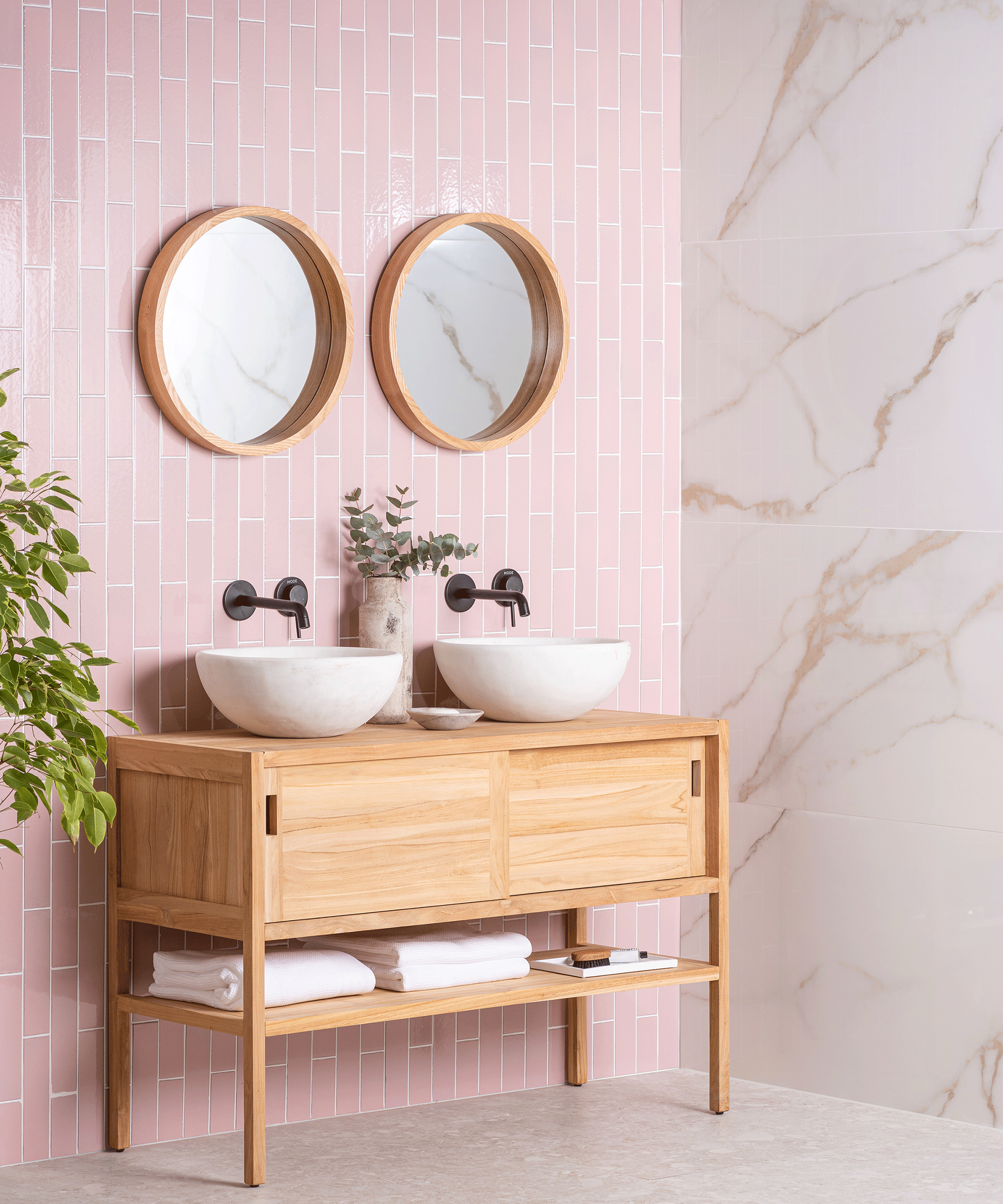 Pink vertical ceramic metro bathroom tiles in a modern bathroom, with another marble wall