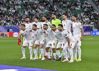 Iran players line up ahead of their 2023 Asian Cup semi-final against Qatar.