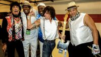 From left, musicians Ron Wood, unidentified, Buddy Guy, Jeff Beck, and Narada Michael Walden pose backstage at Eric Clapton's Crossroads Guitar Festival at Toyota Park, Bridgeview, Illinois, August 26, 2010.