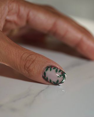 French manicure with holiday-inspired nail art by Iram Shelton