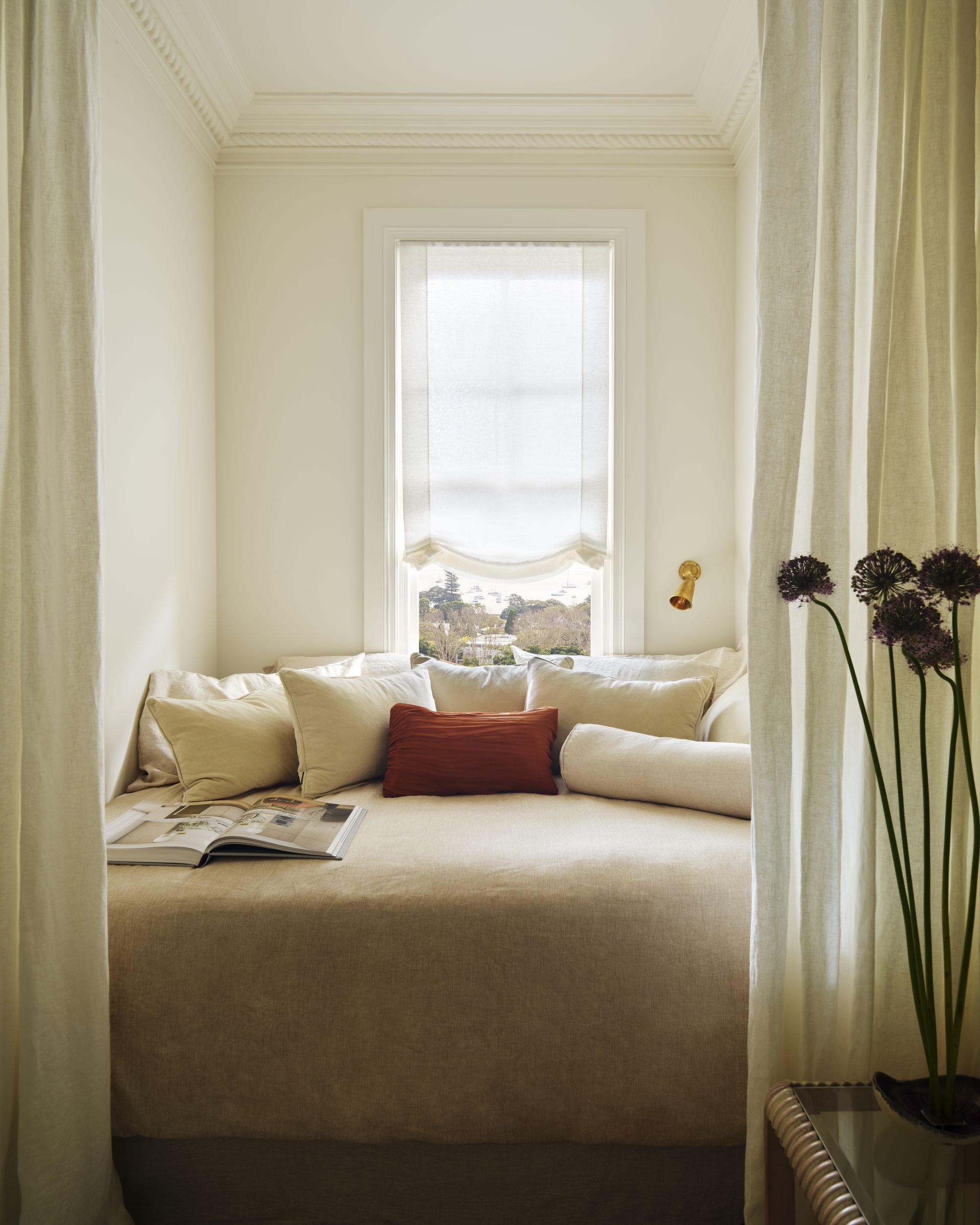 a bed nook with privacy curtain