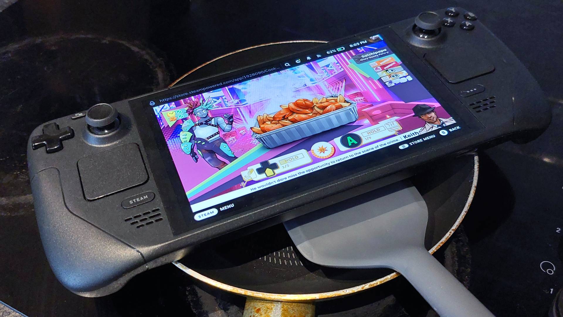 A surreal photo where a Steam Deck handheld gaming pc has been placed over the top of a much too small frying pan. Someone is attempting to flip the Steam Deck with a grey, silicone spatula.