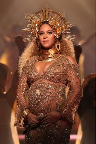 Singer Beyoncé wears a gold outfit during The 59th GRAMMY Awards at STAPLES Center on February 12, 2017 in Los Angeles, California.