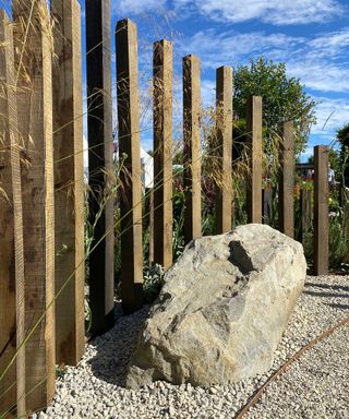 boulders and timber screen in 'A Journey, in collaboration with Sue Ryder'