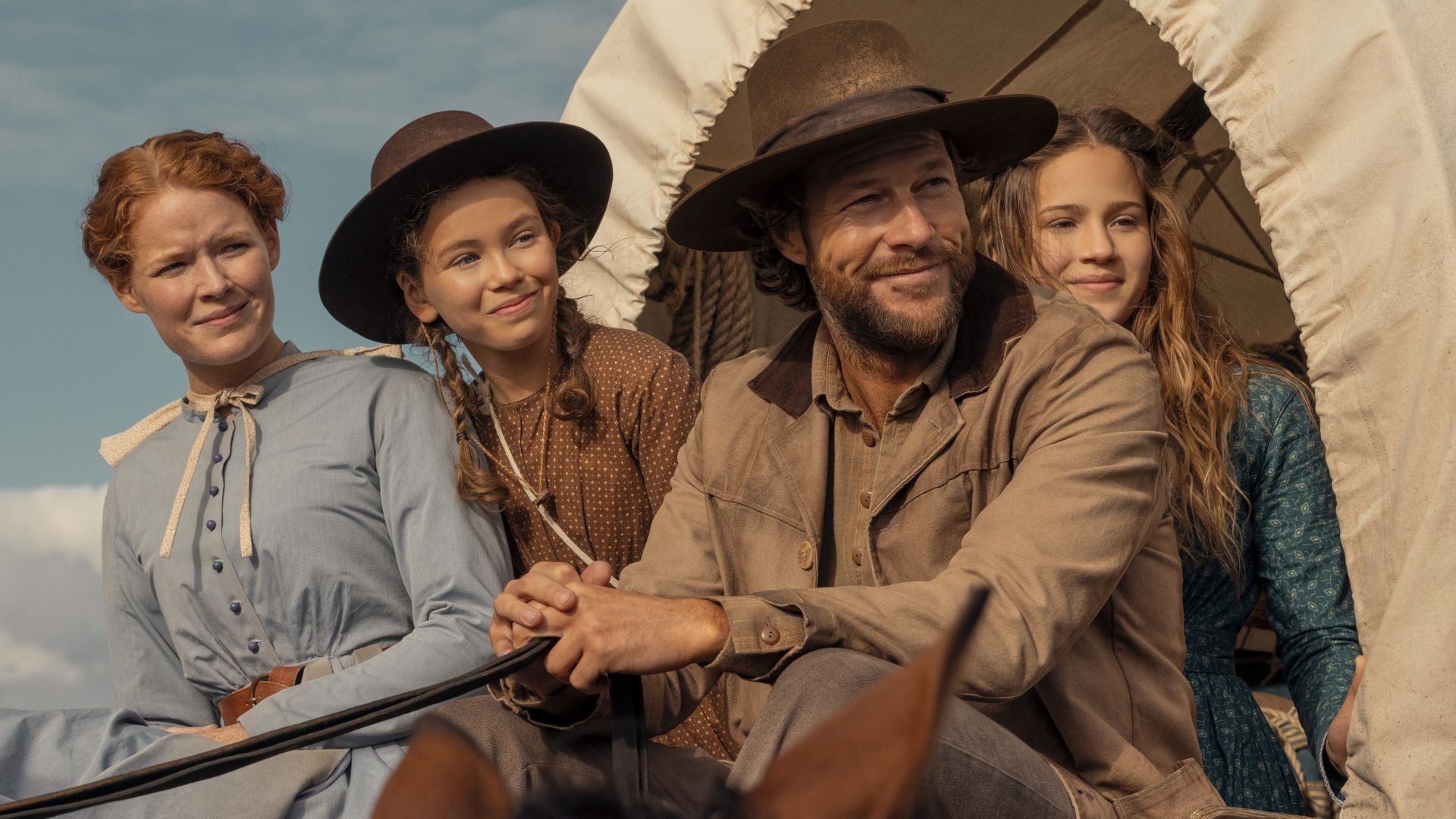 The Ingalls family ride in a wagon