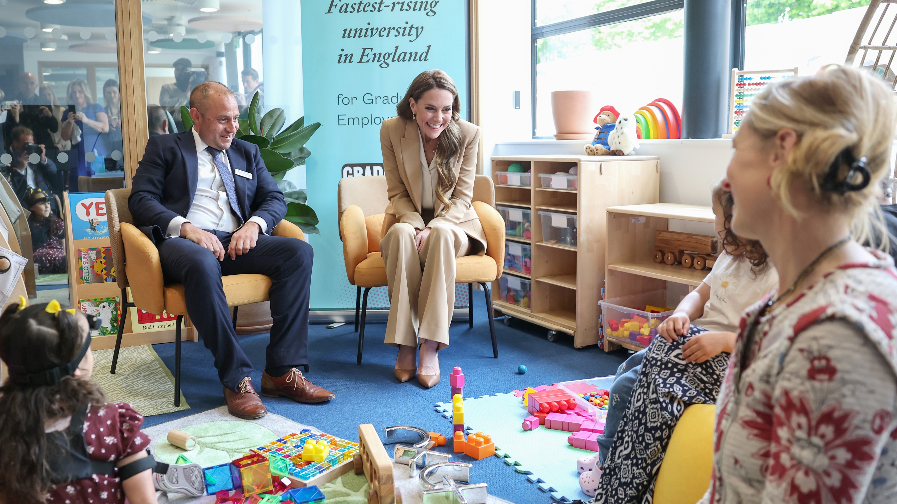Catherine, Princess of Wales smiles as she meets families with babies and young children to discuss research during the launch of "Foundations for Life: A Guide to Social and Emotional Development"