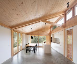 light, wood-lined sloping ceiling inside Casa GE, Spain, by Alventosa Morell Arquitectes