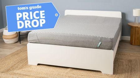 The Siena Memory Foam Mattress on a bed frame in the Tom's Guide testing studio, in the top left corner is a Tom's Guide Price Drop deals graphic