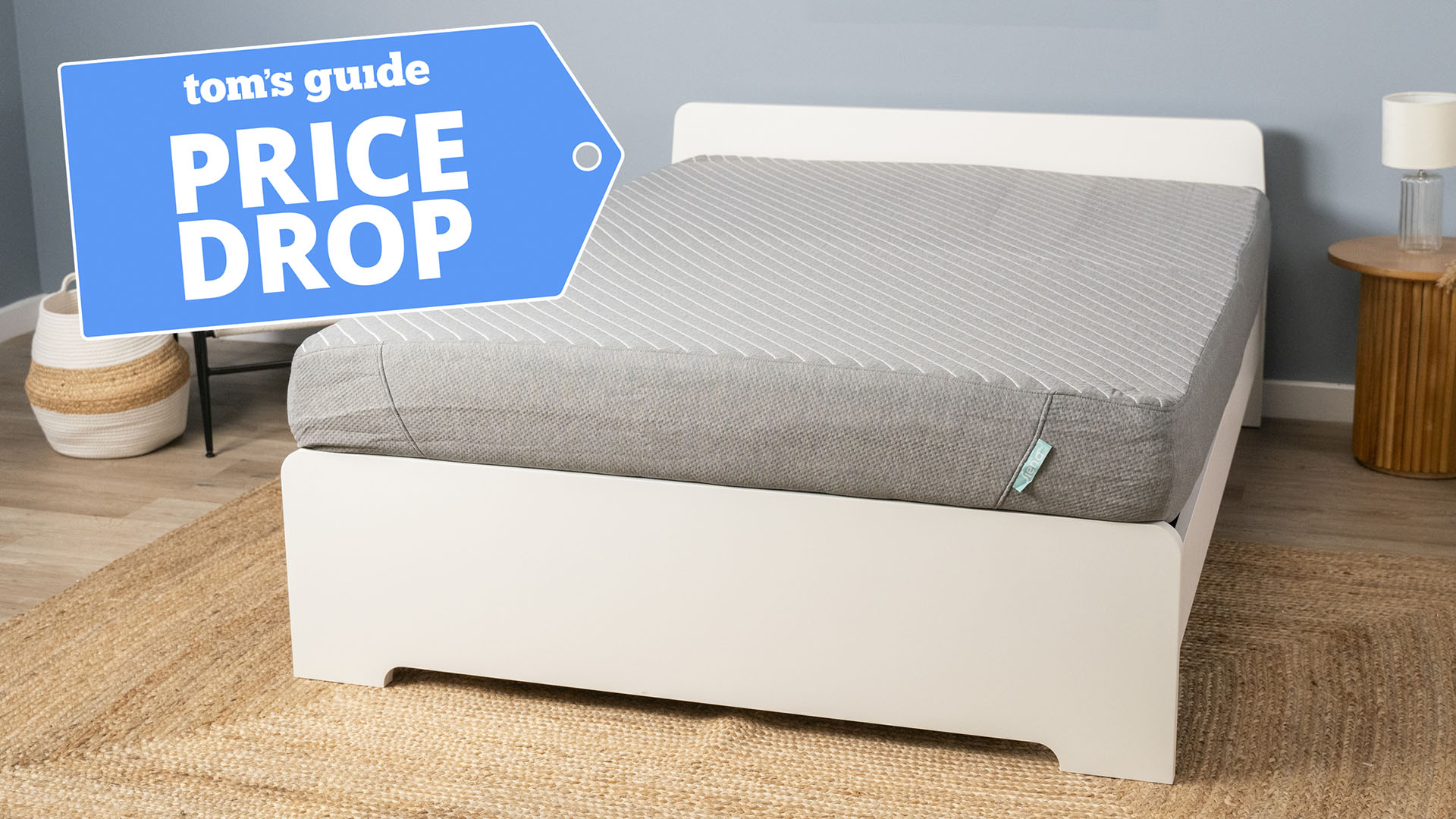 The Siena Memory Foam Mattress on a bed frame in the Tom&#039;s Guide testing studio, in the top left corner is a Tom&#039;s Guide Price Drop deals graphic