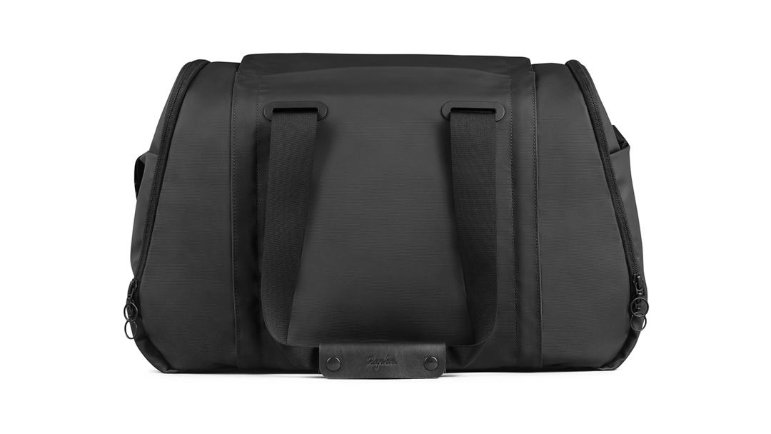 The bag features both shoulder straps and handles
