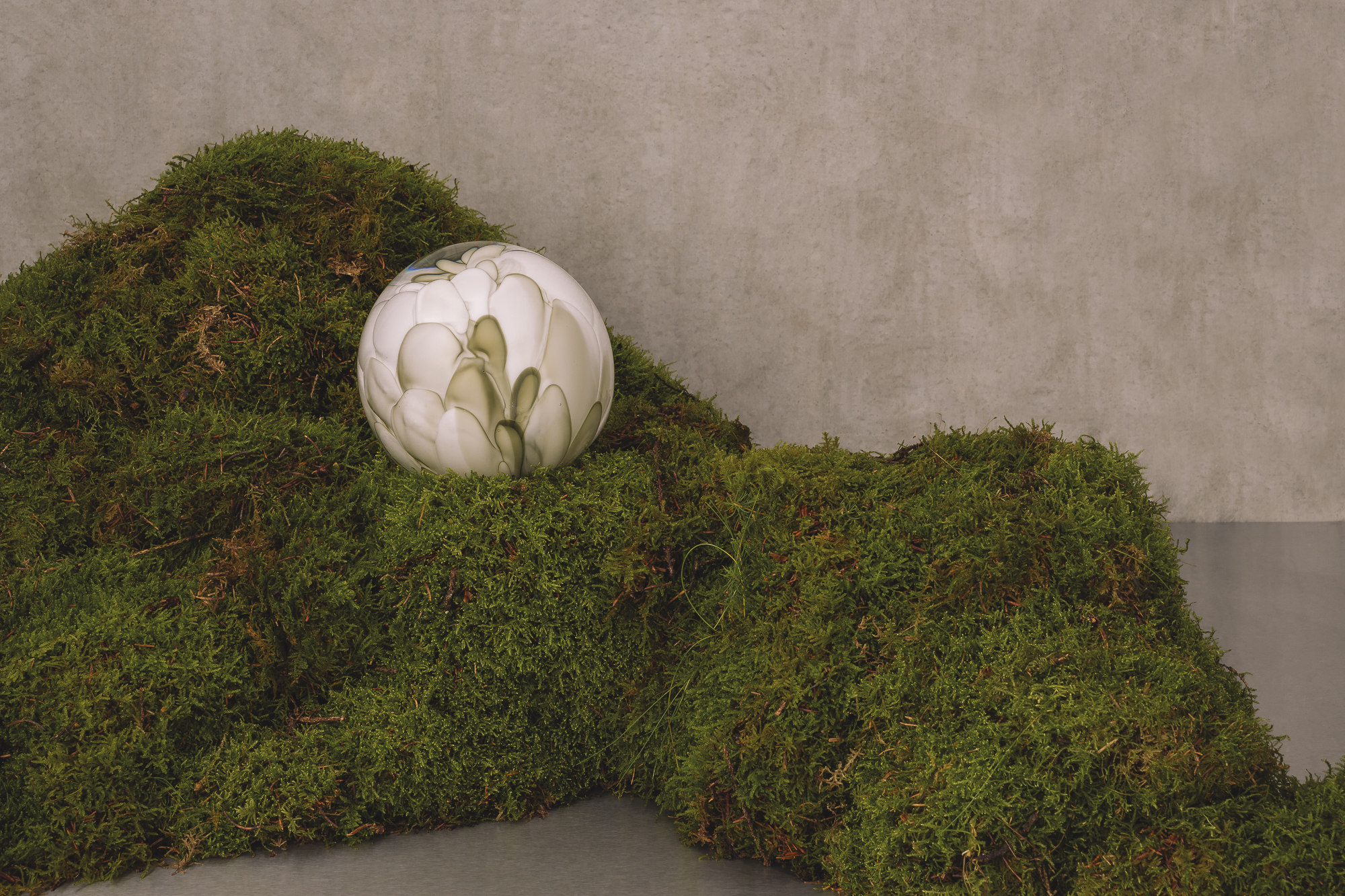 hand-formed glass lamps arranged in floral displays