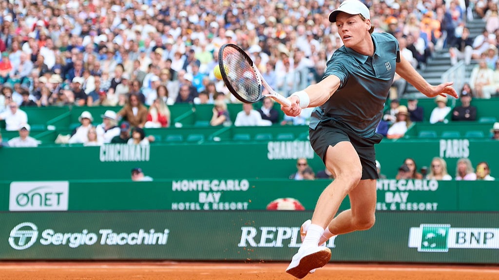 Jannik Sinner stretches to play a backhand at the Monte-Carlo Masters 2026