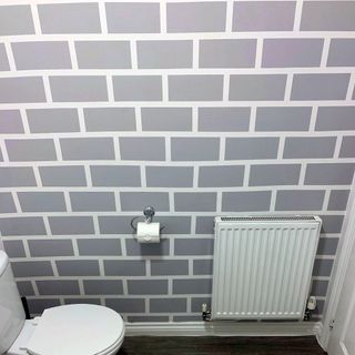 bathroom makeover with brick wall painitng