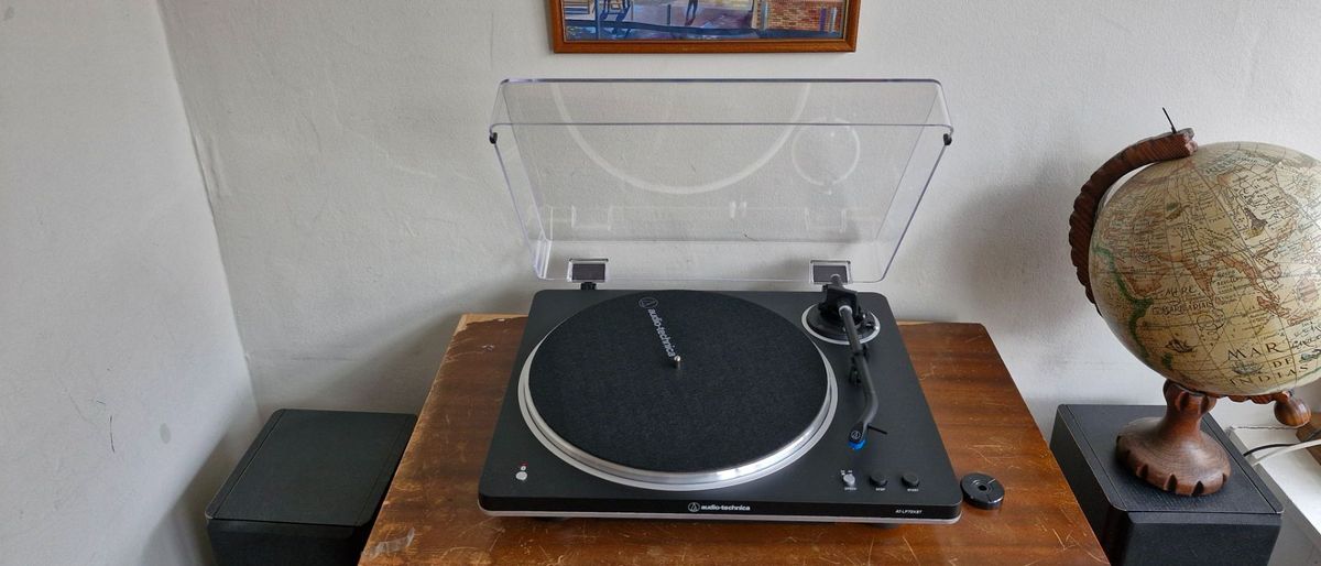 Audio-Technica AT-LP70XBT turntable on a wooden table