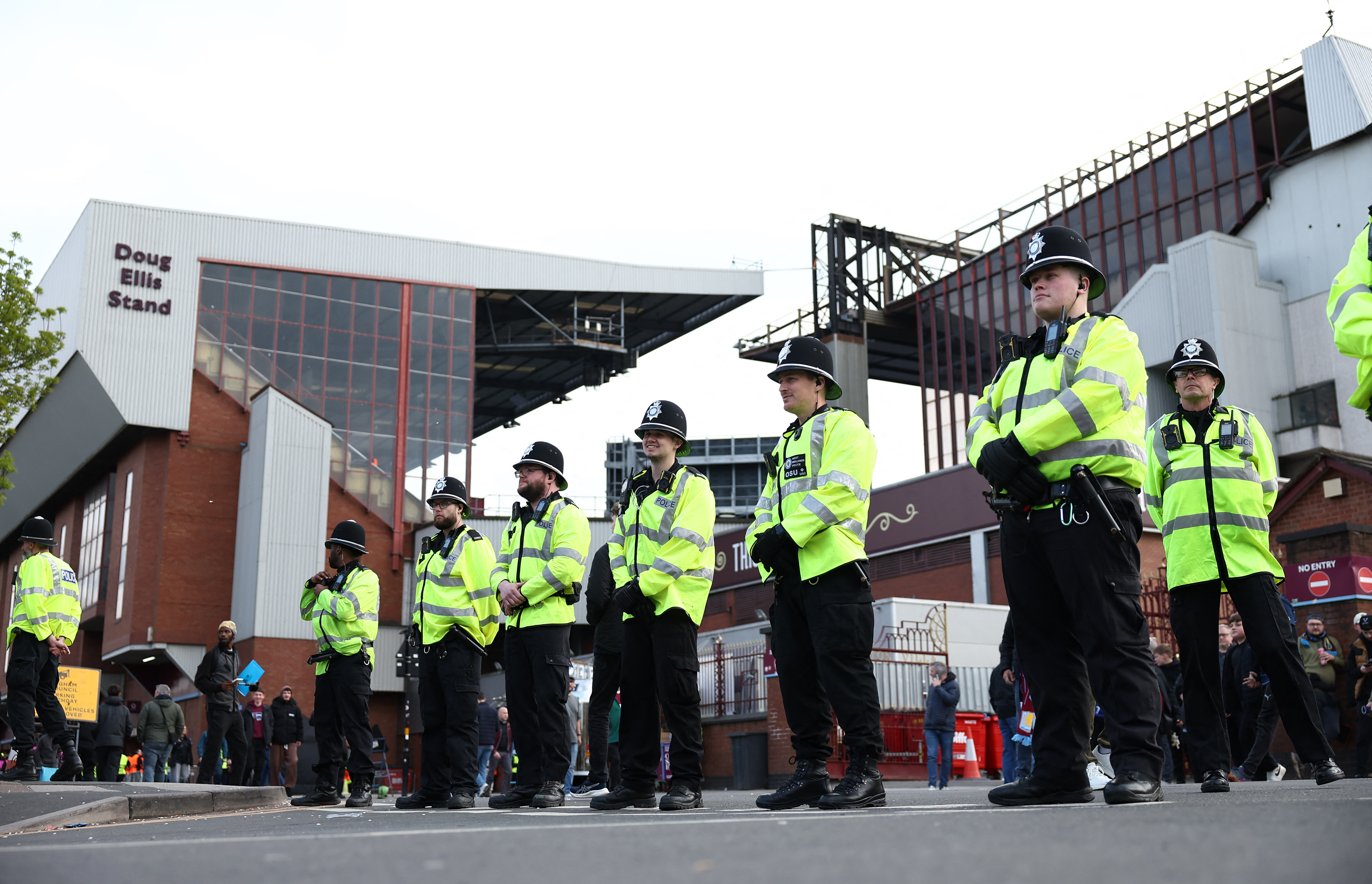 Police officers stand on duty ahead of the UEFA Champions League quarter-final second-leg football match between Aston Villa and Paris Saint-Germain at Villa Park in Birmingham, central England on April 15, 2025. (Photo by FRANCK FIFE / AFP)