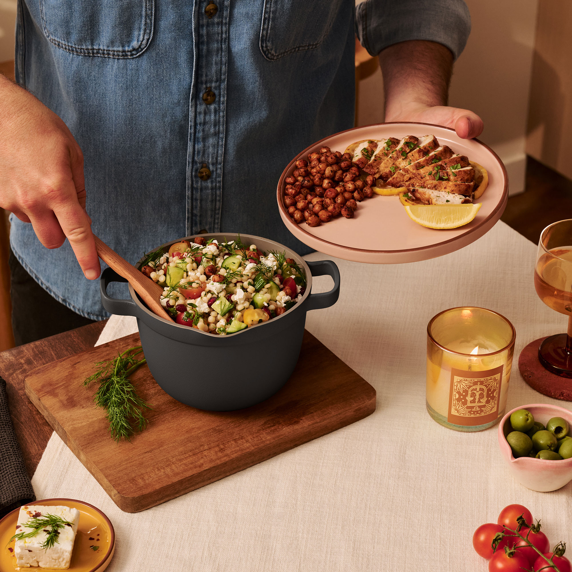 Person spooning couscous out of small pot