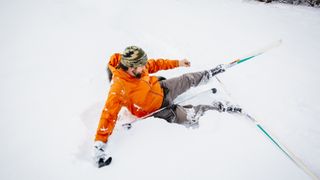 A man falls on cross country skis
