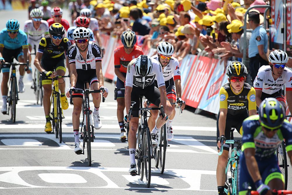 Chris Froome (Team Sky) loses time after crashing into a ditch during stage 1