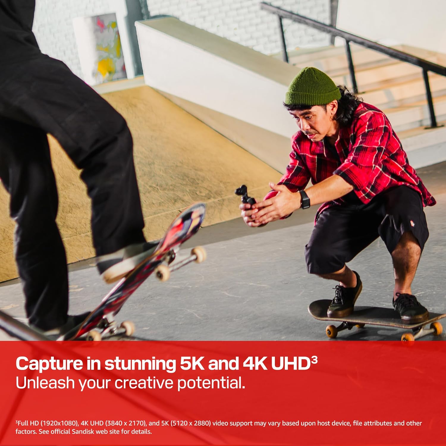 A skateboarder in a red plaid shirt crouches, filming with a camera in a skatepark. Another skateboarder in motion is blurred in the foreground. Text: "Capture in stunning 5K and 4K UHD."