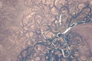 Meander scars, oxbow lakes and abandoned meanders in the broad flood plain of the Rio Negro, Argentina. 